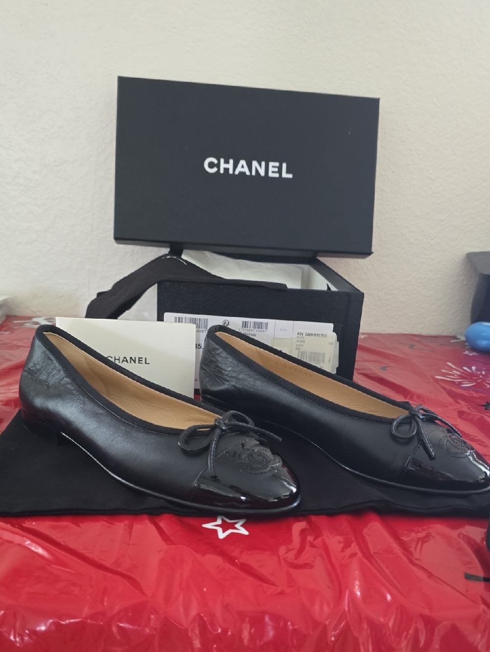 CHANEL Black Leather Ballet Flats with Patent Cap and Bow